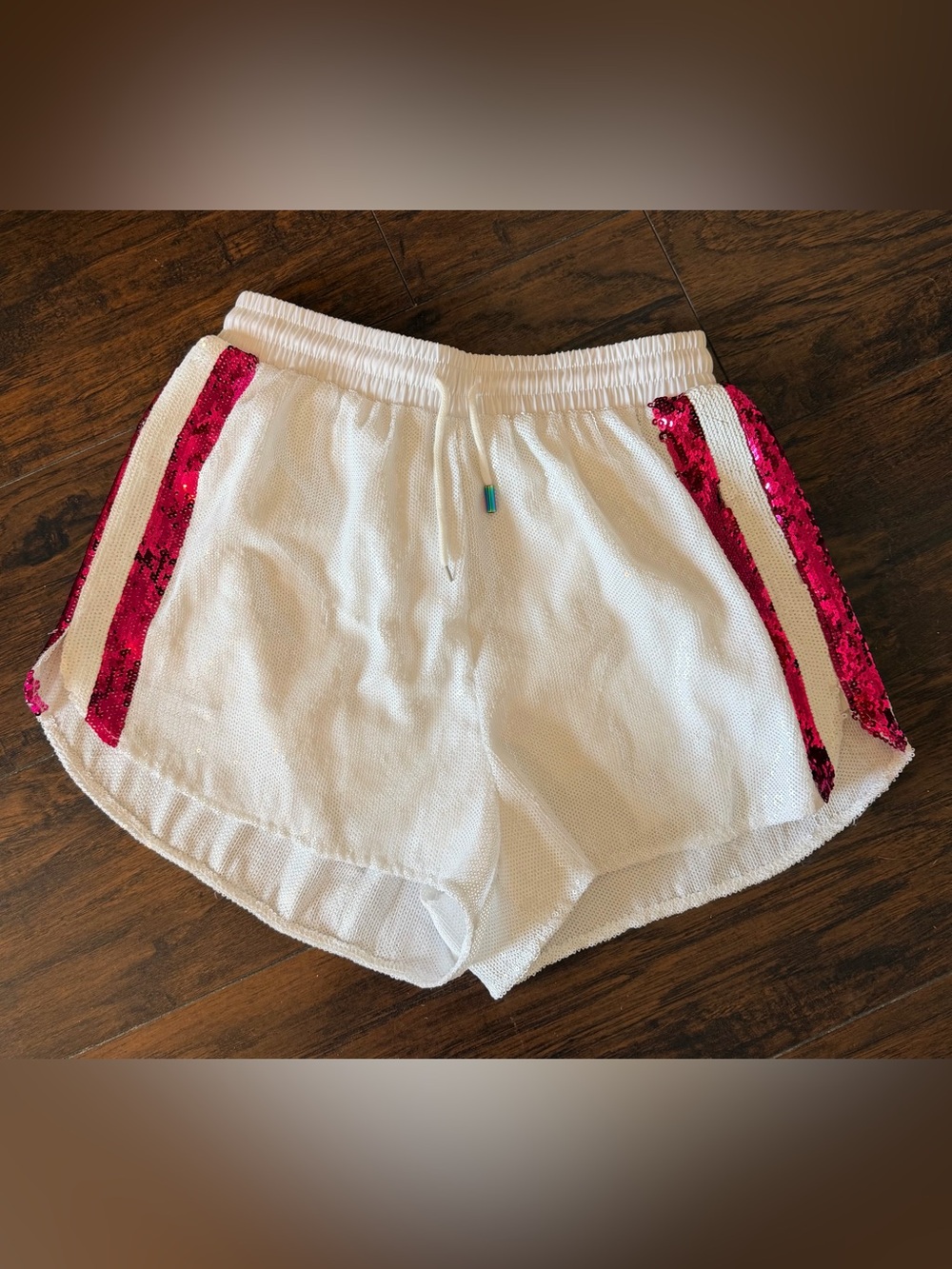 QUEEN OF SPARKLES White Athletic Shorts with Hot Pink Sequin Side Stripes